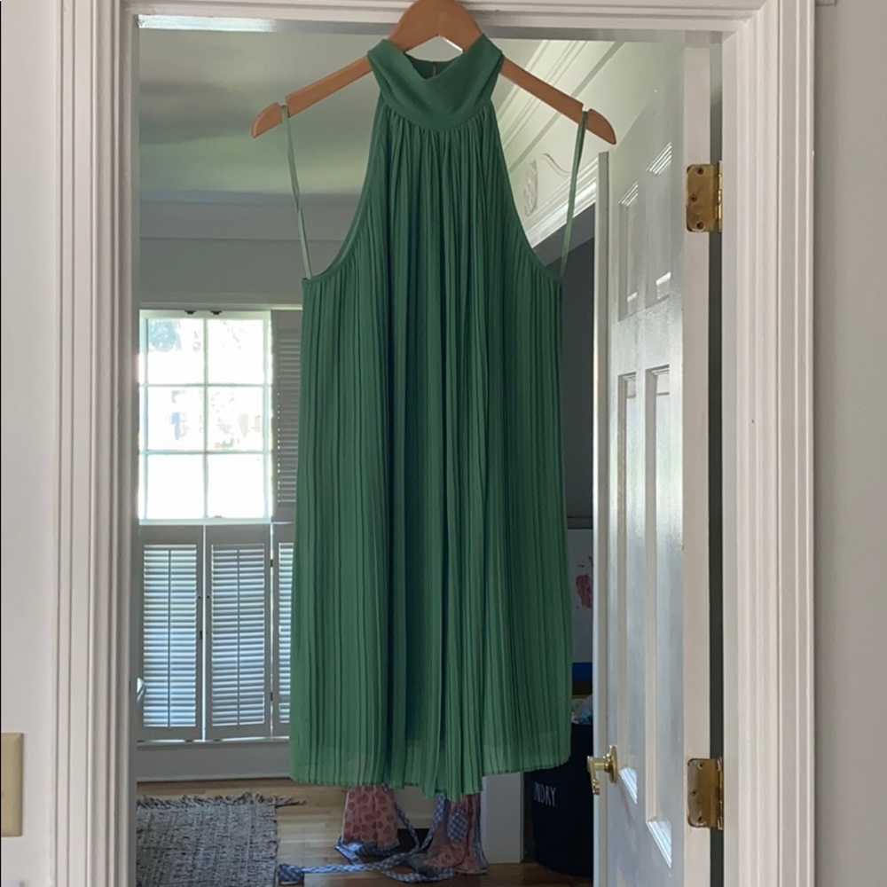 Green chiffon dress, pleated in front.